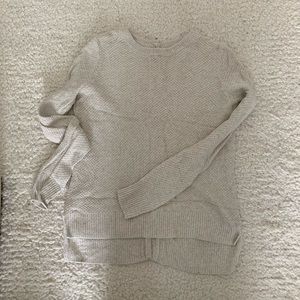 Cream colored sweater with button back detail